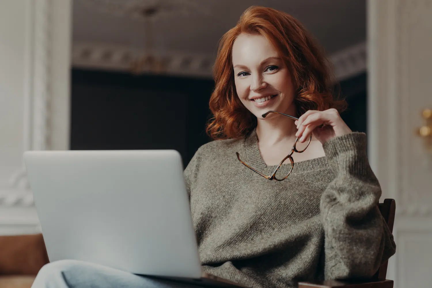 Woman with a computer happy she just called Real Divorce Solutions.